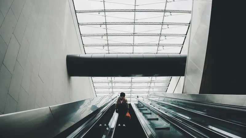 person on escalator